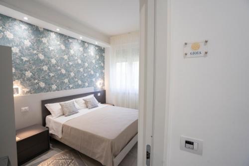 Una cama o camas en una habitación de B&B Sant'Allegria