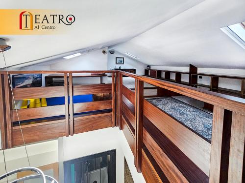 a room with wooden panels and a tv on a boat at Teatro al Centro in Ancona