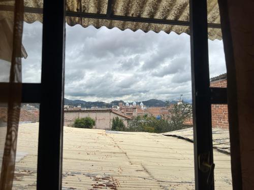 a view of a city from a window at La Querencia in Cuenca