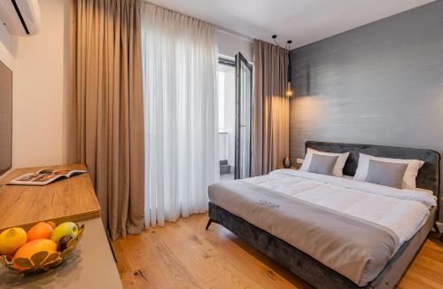 En eller flere senge i et værelse på Cavar Aparthotel