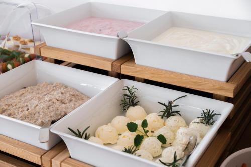 two trays of cheese and dumplings on display at Das Kaya Hotel Stuttgart Airport Messe in Filderstadt