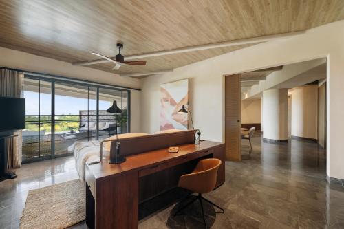a living room with a desk and a couch at Atelier Playa Mujeres- Adults Only - All Inclusive Resort in Cancún