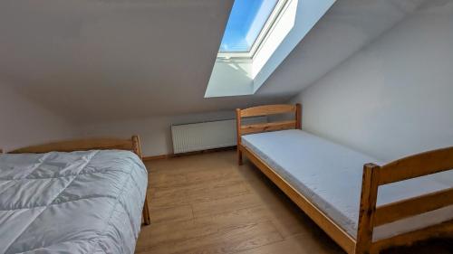 a bedroom with two bunk beds and a window at LaSitta Apartamenty in Starzno