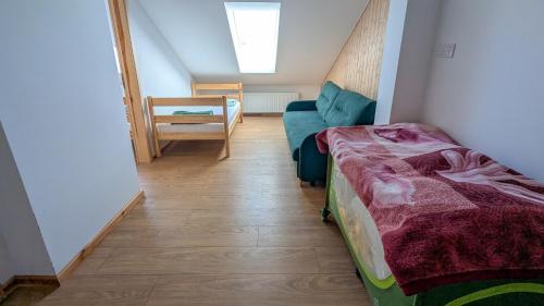 Ένα ή περισσότερα κρεβάτια σε δωμάτιο στο LaSitta Apartamenty