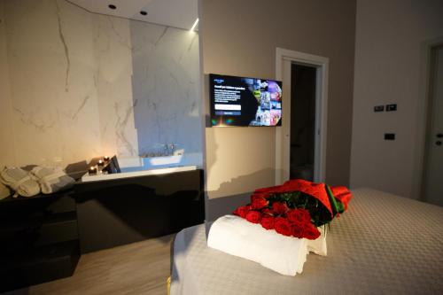 a bedroom with a bed with a sink and a mirror at MAZZINI PALACE in Misterbianco