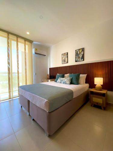 Ένα ή περισσότερα κρεβάτια σε δωμάτιο στο Lujoso con terraza, vista al mar y reserva natural