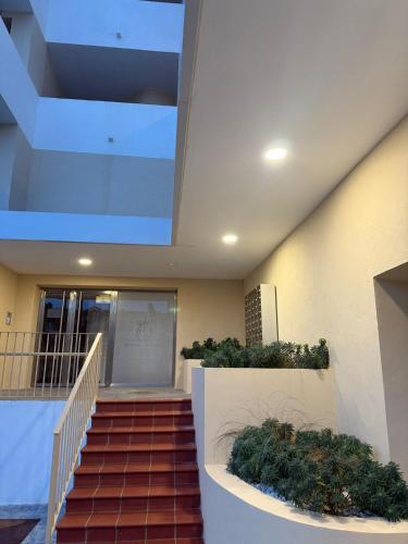a staircase in a building with some plants at ROYAL DUQUESA HILLS - La Duquesa, Sabinillas, Manilva, Málaga - 513 in Manilva