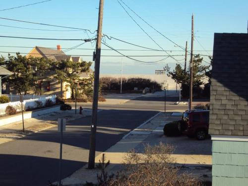 a street with a car parked in a parking lot at Ocean Side Home In Brant Beach 36525 in Brant Beach