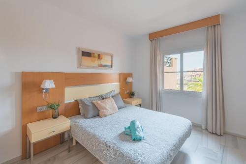 Posteľ alebo postele v izbe v ubytovaní SkySea Holidays Riviera del Sol