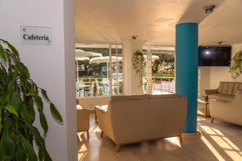 TV a/nebo společenská místnost v ubytování Hotel Coral Reef Cartagena