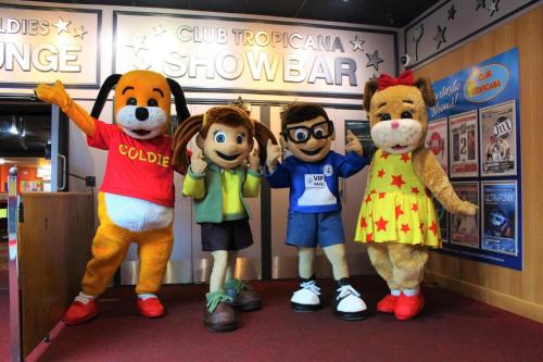 a group of mascots standing in a room at Golden Palm Resort - Willerby Avonmore - Coastal Caravan Breaks in Chapel Saint Leonards