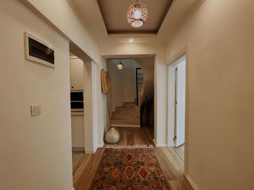 a hallway of a home with a rug and a ceiling at Marla Suite Fethiye in Fethiye