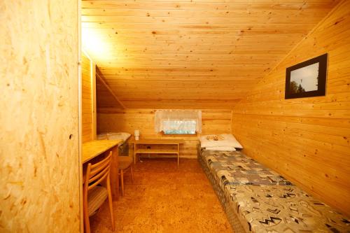 Postel nebo postele na pokoji v ubytování Komáří Louka