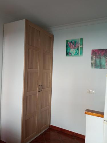 a kitchen with a closet and a door at La Casita 18 in Ardales