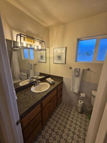 a bathroom with a sink and a toilet at Make Your Friends Jealous! in Indio