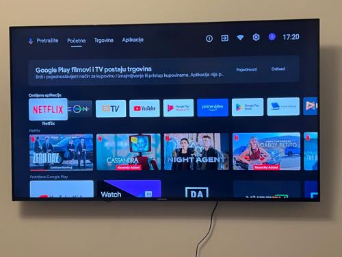 a television screen with a bunch of websites at Stupine Gold in Tuzla