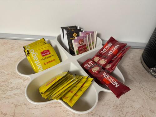 a white tray with packets of food and other snacks at Stupine Gold in Tuzla