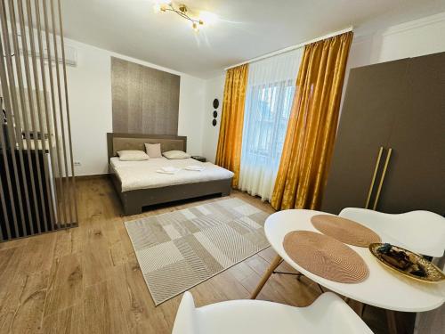 Ένα ή περισσότερα κρεβάτια σε δωμάτιο στο Serenity Apartments and Studios