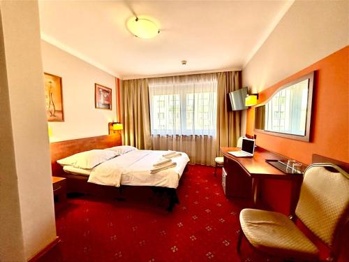Postel nebo postele na pokoji v ubytování Hotel Orion