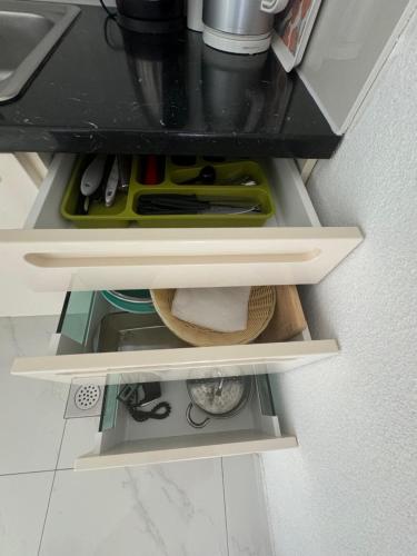 a drawer in a kitchen with tools in it at Apartments Funtana with pool in Funtana