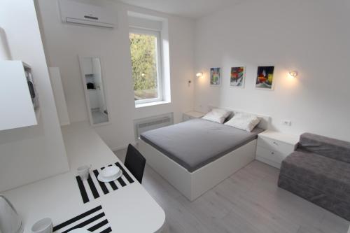 Кровать или кровати в номере Apartments Simple Teslina