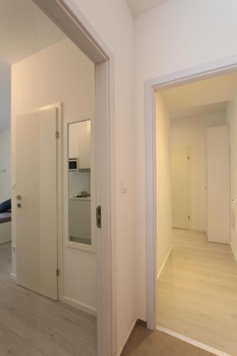 an empty room with a door and a hallway at Apartments Simple Teslina in Zagreb