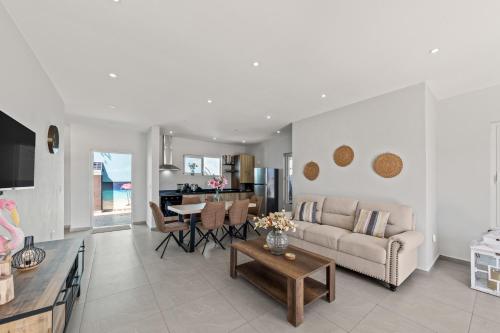 a living room with a couch and a table at Casa Flamingo in Grote Berg