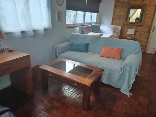 a living room with a couch and a coffee table at Casa Betania ocean view in La Orotava