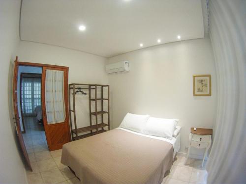 Ein Bett oder Betten in einem Zimmer der Unterkunft Hospedaria Shaolin na Lagoa da Conceição
