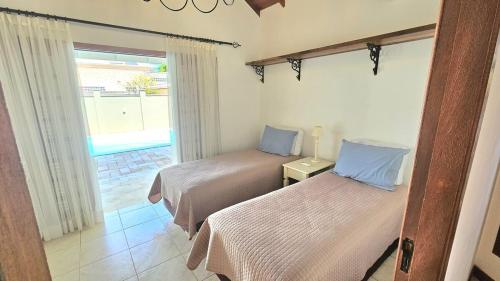 Ein Bett oder Betten in einem Zimmer der Unterkunft Hospedaria Shaolin na Lagoa da Conceição