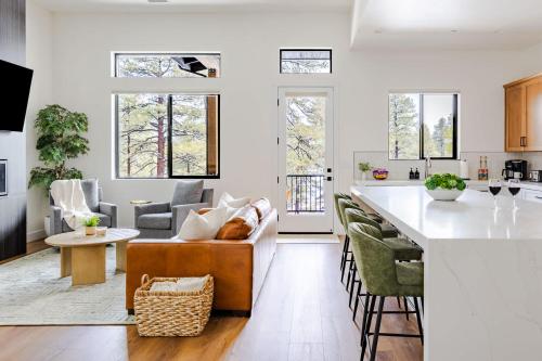 a kitchen and living room with a couch and a counter at Home with Studio near Pine Canyon in Flagstaff