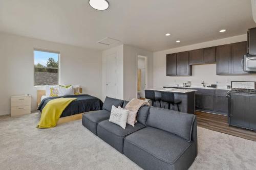 a living room with a couch and a bed at Flagstaff Studio Near NAU in Flagstaff
