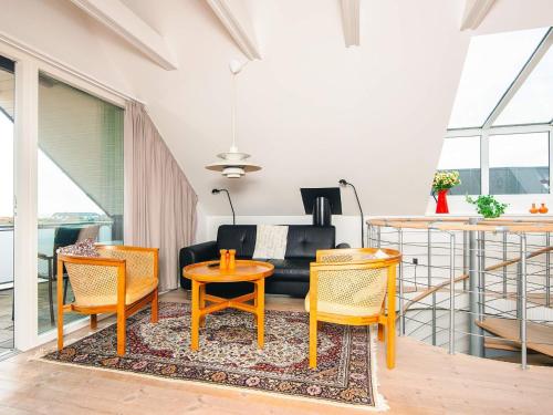 a living room with two chairs and a table at Luxury Panoramic Cottage in Rindby-By Traum in Fanø