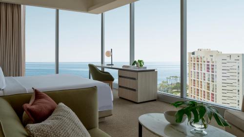 a hotel room with a bed and a view of the ocean at Vignette Collection SOUMA Hotel by IHG in Lima