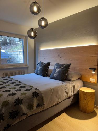 Postel nebo postele na pokoji v ubytování Ciasa Saslonch Apartment