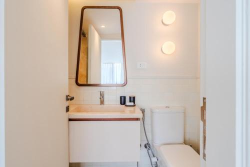 a bathroom with a sink and a mirror at Longchamps l Zamalek l Boutique Hotel with Breakfast in Cairo