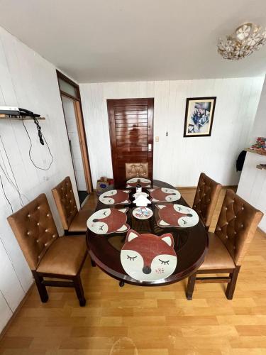 a dining room with a table with bears on it at DEPARTAMENTO FRENTE ARENa 1 in Lima