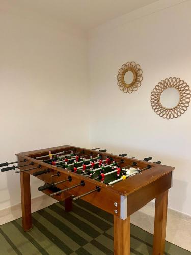 a foosball table in a corner of a room at Casa da Sofia by Rosado in Olhão