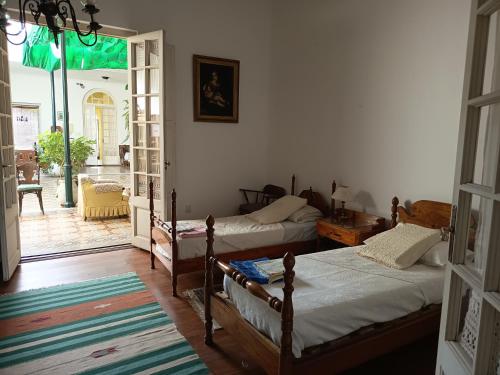 Postel nebo postele na pokoji v ubytování Casa Rosa 3