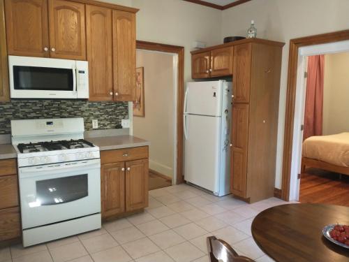 a kitchen with a white stove and a refrigerator at 2 Bedroom Unit and Big Yard 30 Minutes to NY in Ridgefield Park