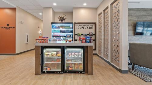 a store with an open refrigerator in a store at Candlewood Suites Perry-National Fairground Area by IHG in Perry