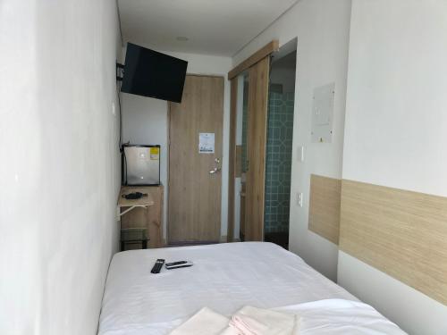 Ένα ή περισσότερα κρεβάτια σε δωμάτιο στο Aparta Suite Vista al Mar Rodadero