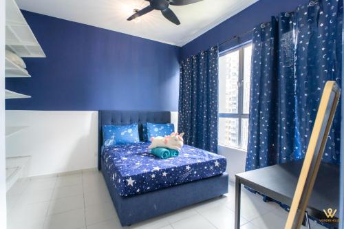 a bedroom with blue walls and a bed with a pig pillow at 3BR Serene Stay in North of Petaling Jaya near MRT station in Petaling Jaya