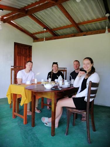 a group of people sitting around a table at Super View in Ella