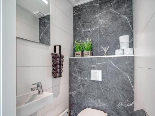 a bathroom with a sink and a toilet at Coastal Comfort with Terrace in Ribnitz-Damgarten