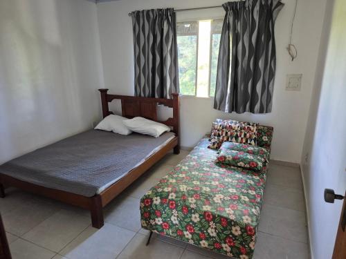 Postel nebo postele na pokoji v ubytování Chácara do Vale