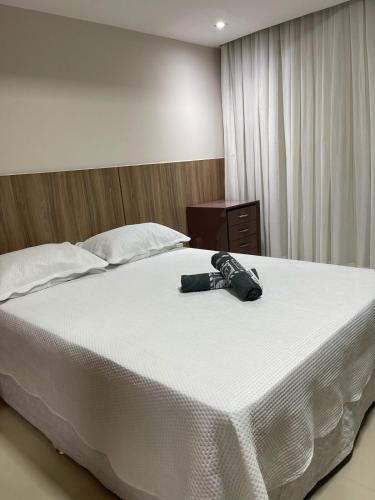 Ένα ή περισσότερα κρεβάτια σε δωμάτιο στο Suíte Premium de Alto padrão III - Climatizado
