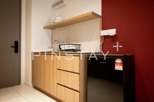 Η κουζίνα ή μικρή κουζίνα στο Bay Suites by Pinstay Plus