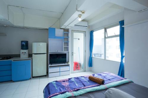 Ένα ή περισσότερα κρεβάτια σε δωμάτιο στο Apartemen Jarrdin Cihampelas B 2223 By PROELIA INDONESIA