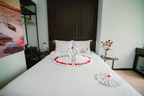 Letto o letti in una camera di Hermes Hotel Nha Trang